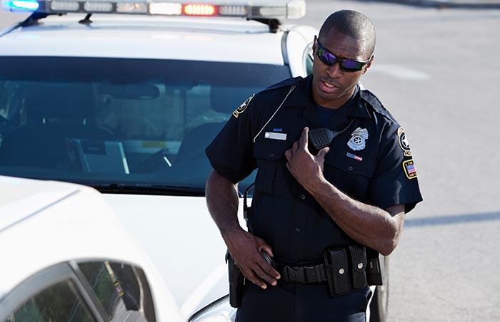 Police officer talking on radio