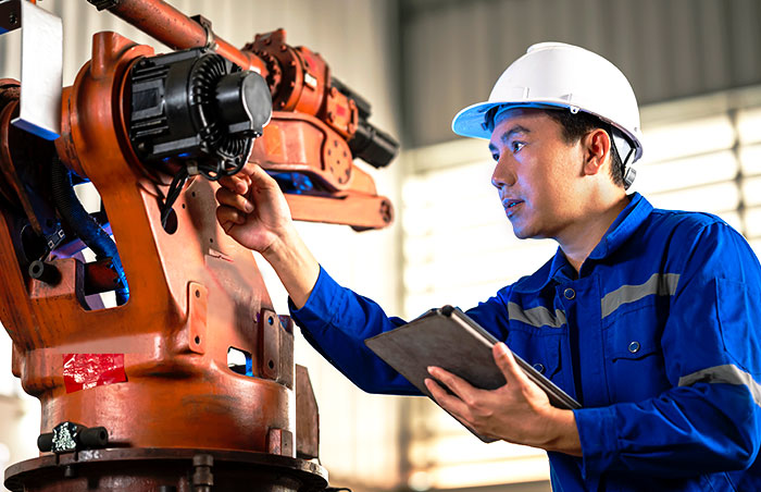 Mechanical engineering technician inspects a large motor