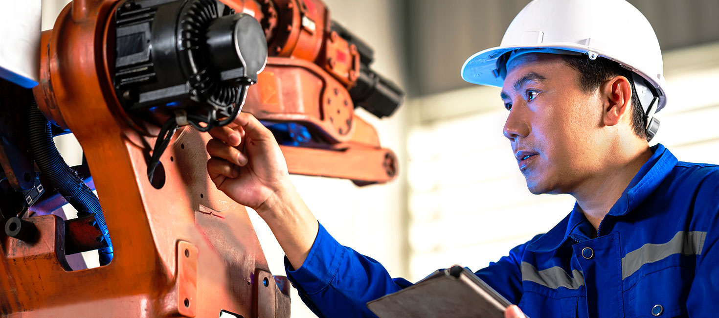 Mechanical engineering technician inspects a large motor