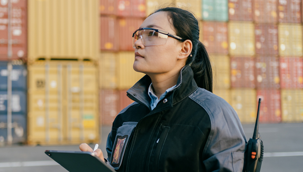Woman at a freight yard with a career in logistics